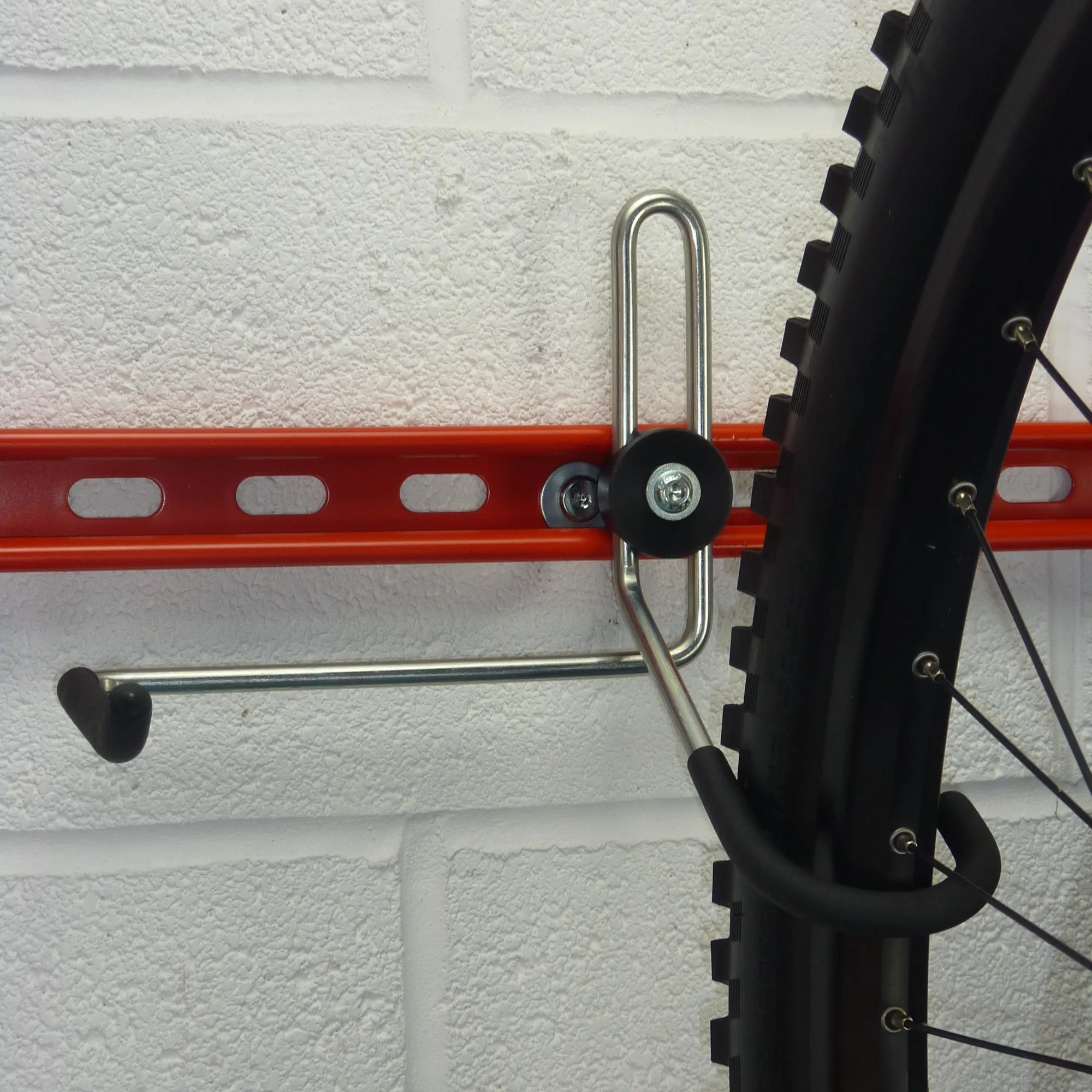 Garage bike rack for 3 bikes   3 sets of helmets, backpacks and coats