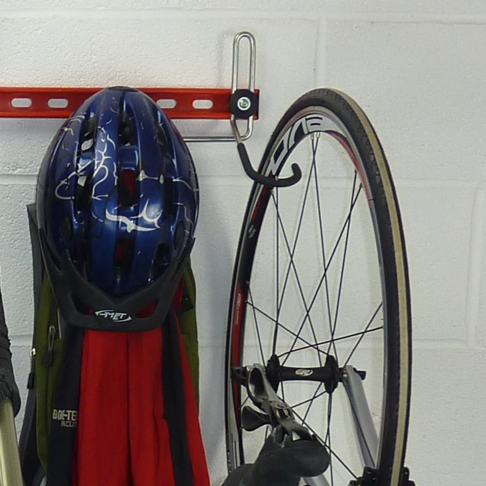 Garage bike rack for 3 bikes   3 sets of helmets, backpacks and coats