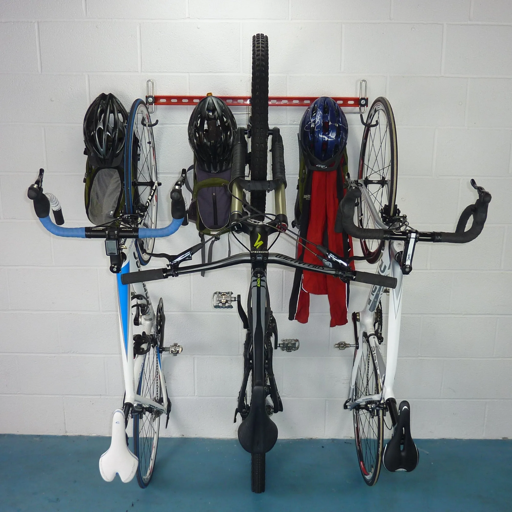 Garage bike rack for 3 bikes   3 sets of helmets, backpacks and coats