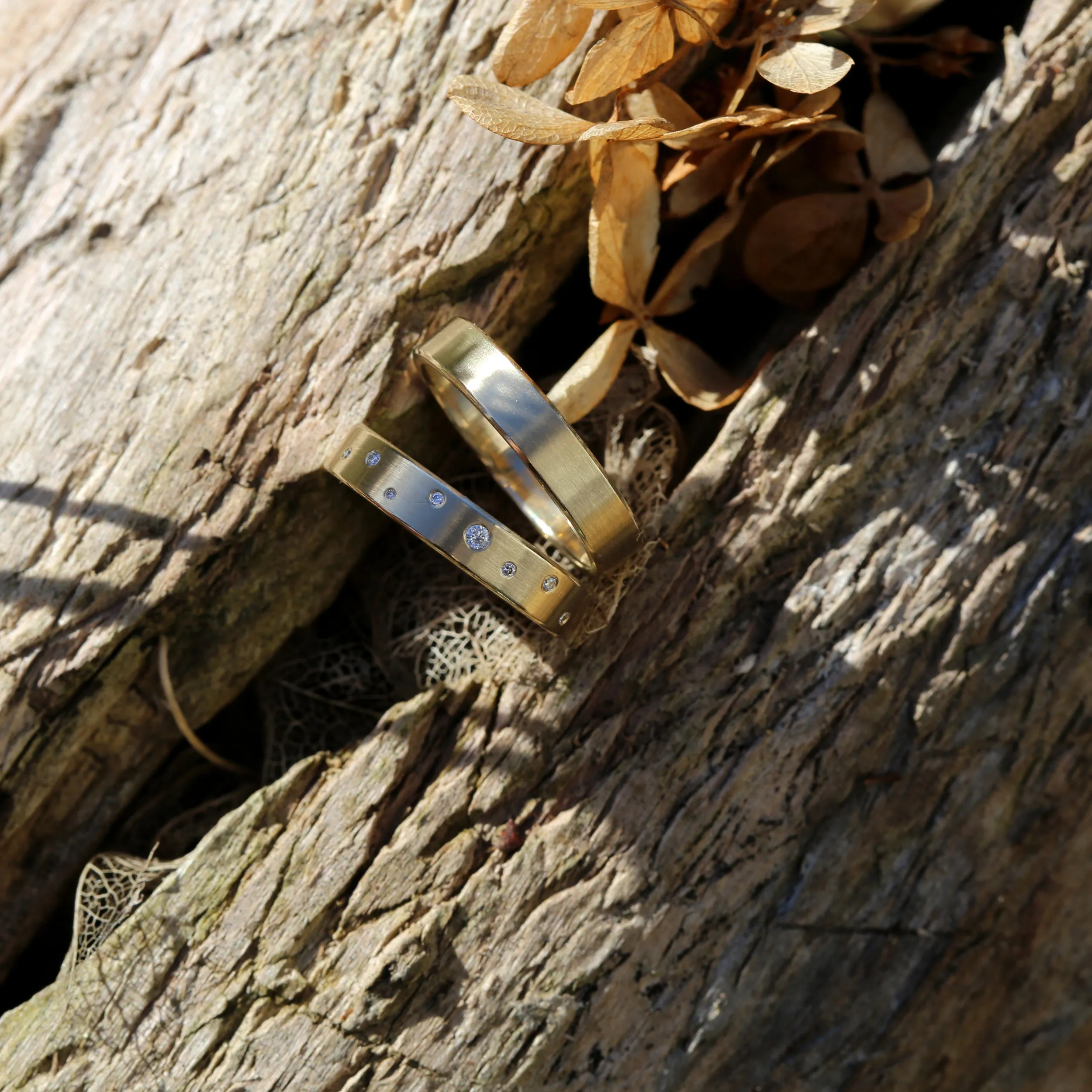 Minimal wedding band in 14k yellow gold with diamonds